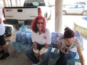 Oldham with bottled water for her house warming party, Cayo District, Belize – Best Places In The World To Retire – International Living